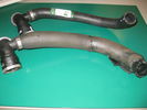 old and new coolant hose.JPG